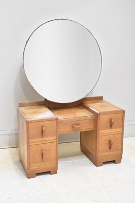 Lot 51 - An Art Deco oak dressing table, with an...