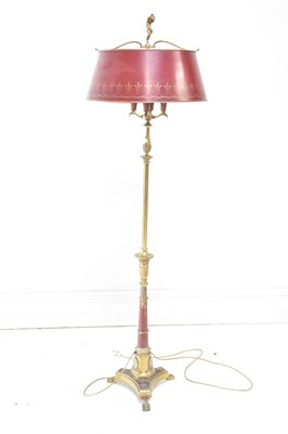 Lot 2049 - A brass and red painted standard lamp, height...