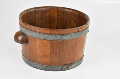 Lot 1084 - A coopered teak twin handled bowl, width 35cm.
