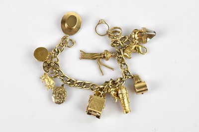Lot 1109 - A 9ct yellow gold heavy gauge charm bracelet,...