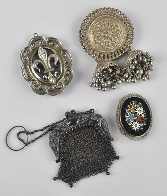 Lot 1021 - A Persian white metal brooch formed as a...