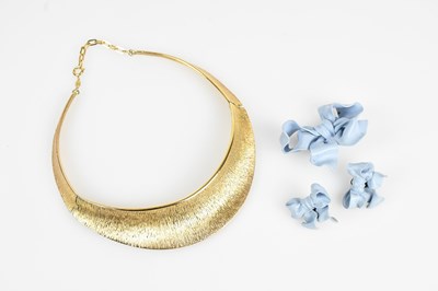 Lot 242 - CHRISTIAN DIOR; a gold tone textured three...