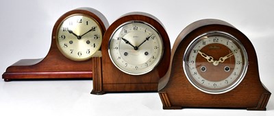 Lot 133 - Three wooden cased Napoleon hat mantel clocks,...
