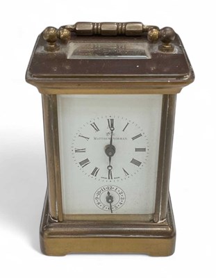 Lot 121 - MATTHEW NORMAN; a small brass and glazed...