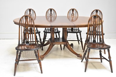 Lot 126 - A reproduction oak extending dining table,...
