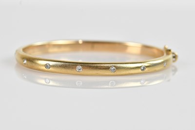 Lot 1138 - A 9ct yellow gold diamond set hinged snap...