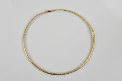 Lot 2160 - A 9ct yellow gold collar with textured...