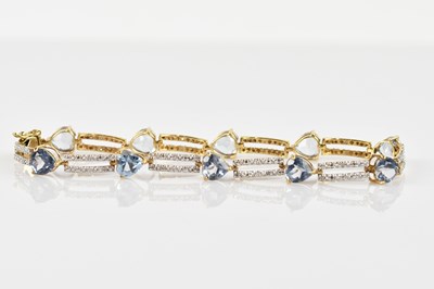 Lot 1202 - A 9ct yellow gold and diamond bracelet, set...