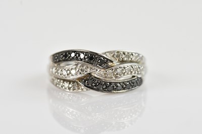 Lot 2416 - A 9ct white gold and sapphire set dress ring,...