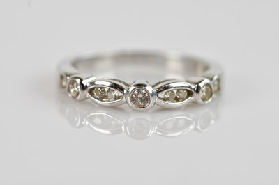 Lot 2377 - A 9ct white gold diamond set dress ring, set...