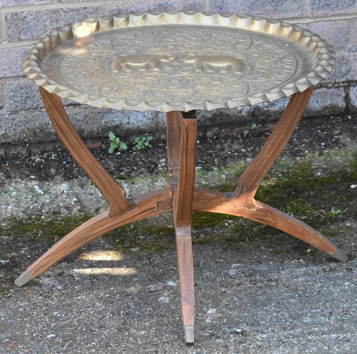 Lot 89 A brass top folding table