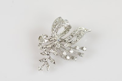 Lot 1270 - A white metal diamond set floral brooch, set...