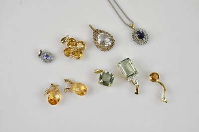 Lot 2094 - A 9ct yellow gold cluster pendant, set with a...