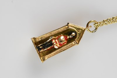 Lot 2158 - A 9ct yellow gold pendant formed as a Queen's...