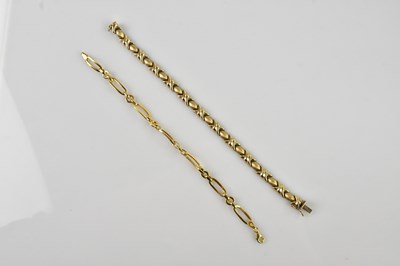 Lot 1197 - A yellow metal bracelet stamped '9ct', length...