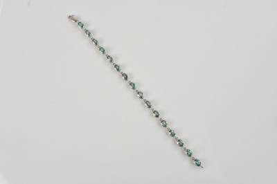 Lot 1233 - A white metal bracelet stamped '375', set with...