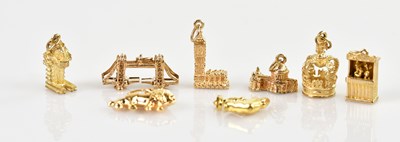 Lot 1456 - Four 9ct yellow gold charms including the...