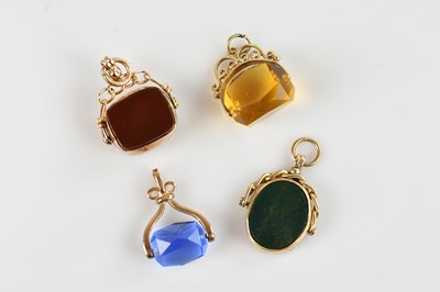 Lot 1455 - Three 9ct yellow gold mounted swivel fobs...