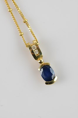 Lot 2135 - A yellow metal diamond and sapphire set...