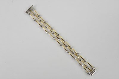 Lot 1117 - A yellow and white metal diamond set three...