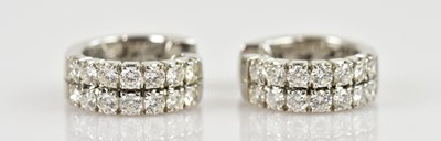 Lot 1373 - A pair of white metal diamond set hoop...