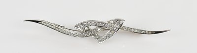 Lot 1299 - An 18ct white gold diamond set brooch, set...