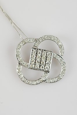 Lot 2129 - A 9ct white gold diamond set pendant, set with...