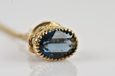 Lot 2181 - A 9ct yellow gold pendant, set with two...