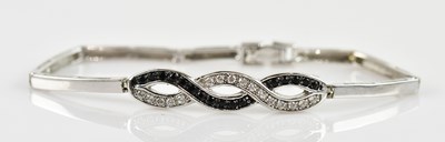 Lot 1210 - A white metal bracelet, set with clear and...