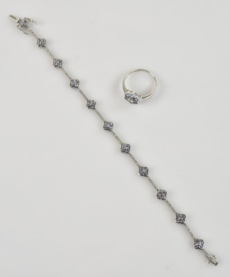 Lot 1207 - A white metal diamond set floral bracelet, set...