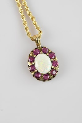 Lot 2090 - A 9ct yellow gold pendant, set with an oval...