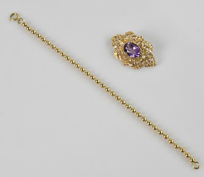 Lot 1289 - A 9ct yellow gold seed pearl and amethyst set...