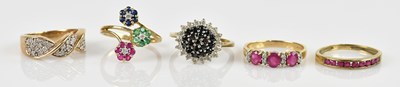Lot 2409 - A 9ct yellow gold diamond set broad ring, with...