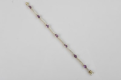 Lot 1248 - A 9ct yellow gold diamond and amethyst set...