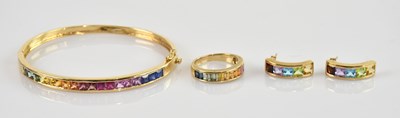 Lot 1128 - A 14ct yellow gold hinged snap bangle, set...