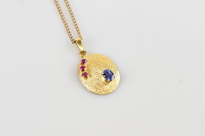 Lot 2137 - A yellow metal sapphire and ruby set textured...
