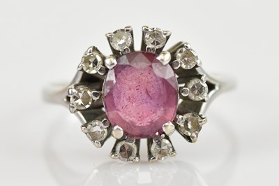 Lot 2404 - An 18ct white gold diamond cluster ring, set...