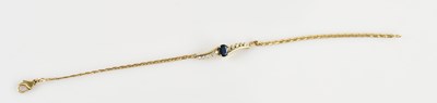 Lot 1250 - A 9ct yellow gold diamond and sapphire...