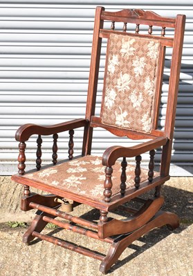 Lot 44 - A mahogany American rocking chair.