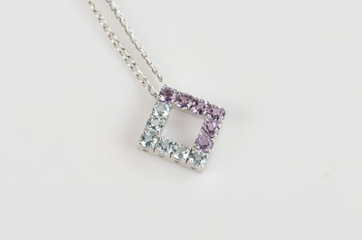 Lot 2139 - A 9ct white gold pendant set with pale blue...