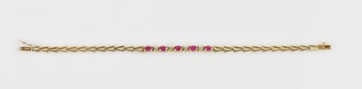 Lot 1235 - A 9ct yellow gold bracelet set with a mêlée of...