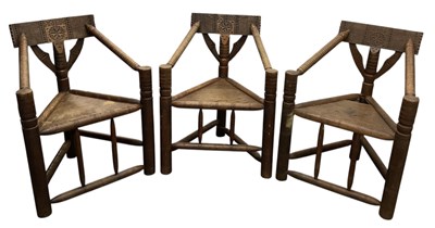 Lot 55 - A set of three African carved hardwood bobbin...