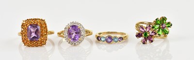 Lot 2398 - Four 9ct yellow gold gem set dress rings,...