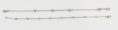 Lot 1236 - Two white metal diamond set fine link...