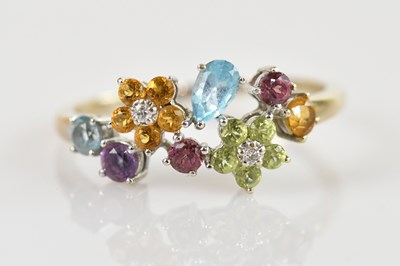 Lot 2396 - An 18ct white gold multigem set dress ring,...