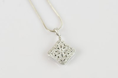 Lot 2166 - A 9ct white gold diamond illusion set locket...