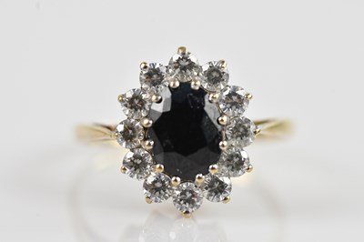 Lot 2520 - A 9ct yellow gold cluster ring, set with a...