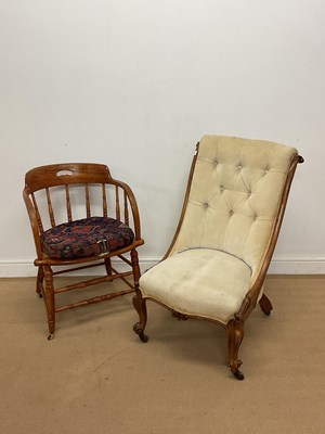 Lot 831 - An oak spindleback captain's chair, together...