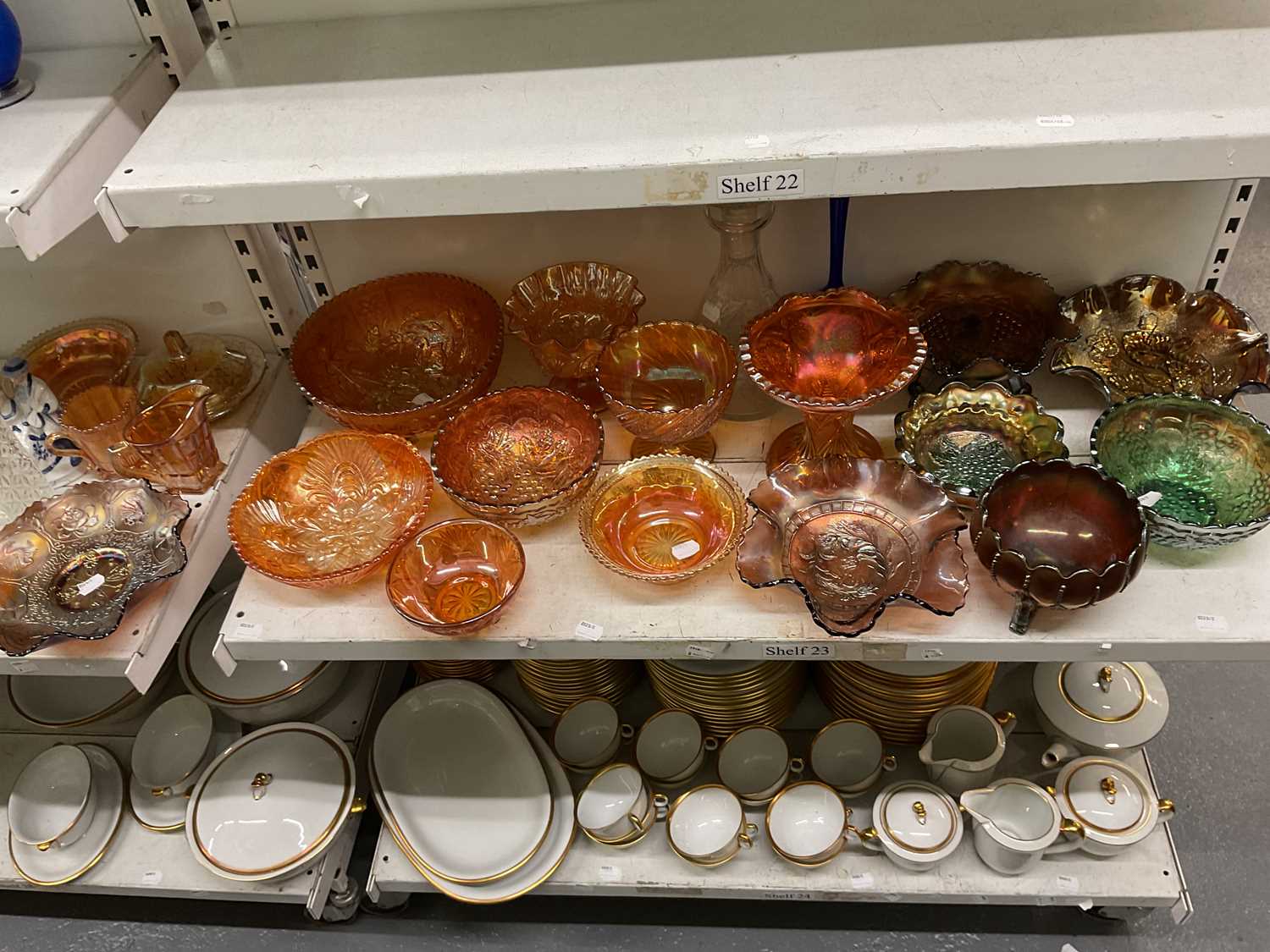 Lot 361 - CARNIVAL GLASS; a collection of mainly orange...