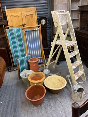 Lot 104 - Two vintage folding deckchairs, terracotta...